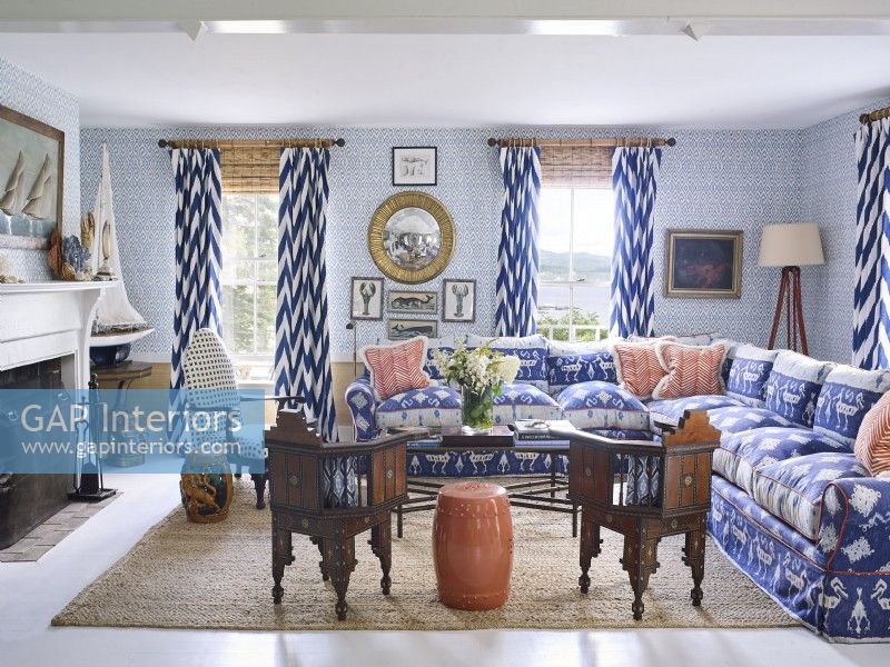 A Maine island cottage living room with antiques, nautical style and water views.