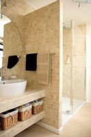 Modern bathroom with large tiled shower enclosure 