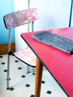 Detail of retro chair in quirky kitchen 