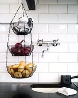 Detail of storage baskets hanging in kitchen