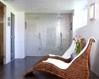 Contemporary bathroom with double shower and seating area