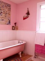 Pink bathroom with freestanding bath
