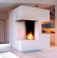 Open plan Scandinavian living area with fireplace 