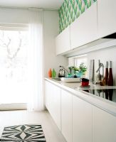 Modern white kitchen with seamless units 