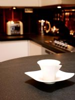 Cup and saucer on kitchen worktop