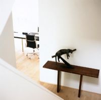 Elevated view of statue on table on hall console table