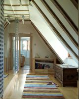 Loft with striped rug on laminate flooring