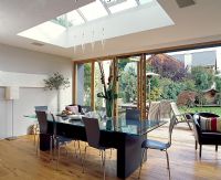 Dining room with open french doors and view of garden