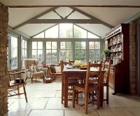 Large dining room with dog on armchair