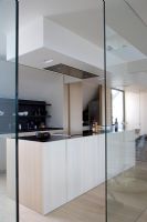 Glass doorway to modern kitchen 