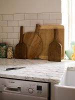 Wooden chopping boards on marble worktop