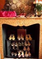 Shoes stored in fireplace
