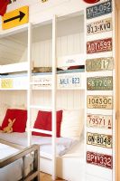 Child's bedroom with bunk beds and vintage license plates