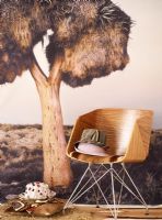 Wooden chair in front of a large wall photo