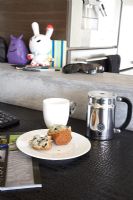 Mug and muffin on table 