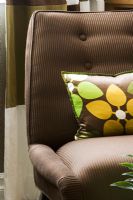 Contemporary Brown Chair with Flower Pillow