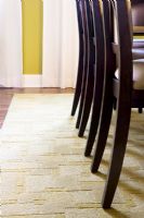Chair Legs on Rug in Dining Room