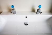 Modern White Sink with Blue Knobs