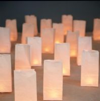Candles in brown paper bags