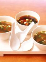 Vegetable soup in bowls with spoons