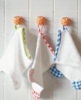 Children's towels hanging on wall