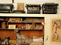 Writing desk with a collection of old typewriters