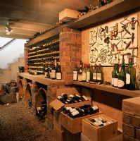 View of wine bottles and crates in wine cellar 
