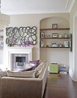 Modern living room with shelves in alcoves