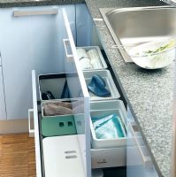View of kitchen counter with open drawer and sink