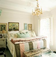 Country style bedroom with patchwork quilt