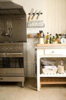 Contemporary kitchen with wooden freestanding storage unit