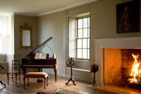 Music room with roaring fire