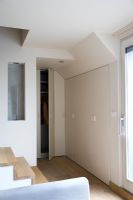 Contemporary hallway with built in wardrobes