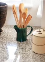 Wooden spoons in a jug