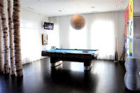 Modern games room with pool table 