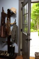 Coats hanging by front door 