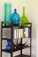 Shelves with books and glassware 