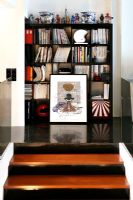 Bookcase at top of modern staircase 