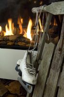Ice skates by burning fire