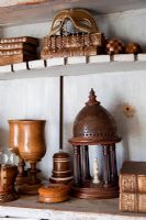 Wooden and leather collectibles on shelves
