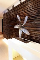 Mounted propeller by wooden feature wall 