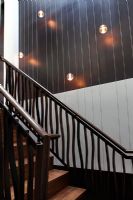 Modern staircase with lighting feature wall