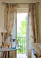 French windows with shutters and curtains 