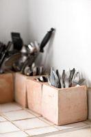 Cutlery and utensils in storage pots 