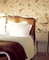 Classic bedroom with floral wallpaper 