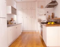 Modern kitchen with large storage cupboards 