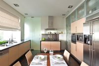 Modern kitchen with dining table 