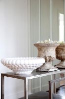 Stone and ceramic bowls on steel table 