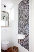 Modern bathroom with mosaic tiled wall