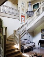 Classic staircase and hallway with modern art